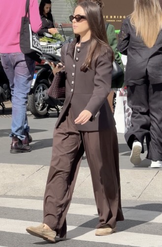 brown blazer adorned with silver buttons