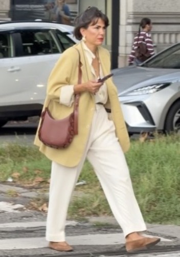 white trousers paired with a button-down shirt
