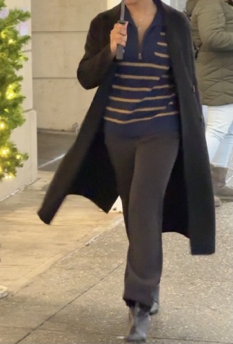 black trousers and a black trench coat