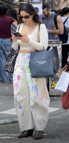 white denim pants with subtle paint splatter