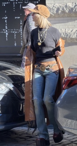 jeans and brown leather trench coat