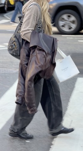 oversized nude sweatshirt and baggy black jeans