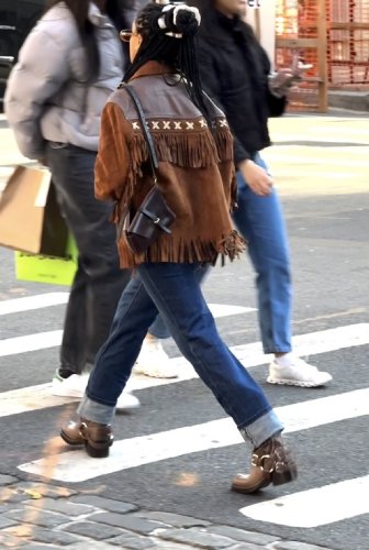 dark-wash cuffed jeans paired with the Motoboy Boots