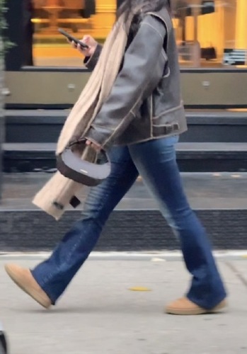 mixed fur and leather coat, a suede fur boot, and a chunky knit scarf